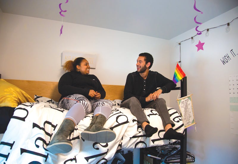 Kalapuya Ilihi offers double and triple room types. Residents talking on bed.